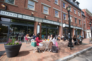 People eating outside restaurant 